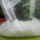 Add the ice cream salt and ice to the larger bag.
