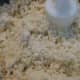 Crumbly mixture after processing - butter and dry ingredients.