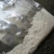 Add flour to a Ziploc bag.
