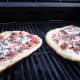 Grill the pizza for 3-4 minutes watching carefully and turning for even grilling.