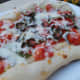 Grilled pizza makes a crisp pizza crust.