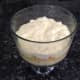 5. Add another layer of cubed cake, sprinkle more Amaretto, and then add layer of pudding.