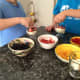 Kids have fun making their own mini trifle desserts.