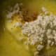Put butter, 1/2 cup powdered sugar, and vanilla into a bowl.