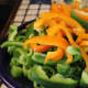 Orange and green Bell peppers. Anaheim, Cubanero and Long Hots