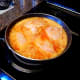 Add 4 chicken breasts to top of rice. Cover with lid and simmer for 25 minutes turning chicken over after 10 minutes.