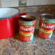 Buy four cans of canned tomato sauce. Look for a variety without added garlic or onion.