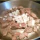 Add 1 cup of chopped onion to the browned stew meat.