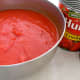 Mix tomato soup with crushed tomatoes and pour over the stuffed peppers and over the meat balls.