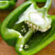 Cut bell peppers in half and remove seeds and stem ends. 