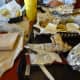 Napkins, wrappers, silverware, cups, lids, straws, and condiments. Look at all that trash.