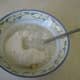 Add freshly ground buckwheat flour and water to the mashed banana and mix gently.