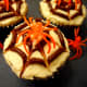 Add a plastic spider ring to finish the cupcake.