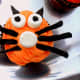 Frost the cupcakes and add the licorice and marshmallows to create the cat face.