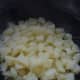 Drain the boiled potatoes then put them back into the pan you cooked them in to start adding butter, milk and mashing them.