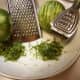 Grated lime zest is smaller, microplaned lime zest is thinner and longer.