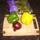 Simple salad ingredients in this instance are green bell pepper, yellow bell pepper, red onion and rocket (arugula)