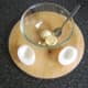 Yolk is scooped out of hard boiled duck egg with a teaspoon