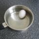 Duck egg is added to a pot of cold water