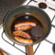 Sausages and black pudding are fried first
