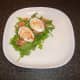 Smoked salmon deviled duck eggs are laid on the salad bed