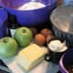 Ingredients for the apple bundt cake, and the floured bundt tin.