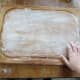 Lightly dust a clean, flat surface with flour.