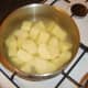 Potatoes are chopped for boiling