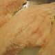 Raw catfish fillets are cleaned and ready for savory seasonings.