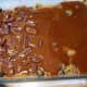 Blanket wth caramel sauce and pecans.