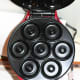 Inside of the mini donut maker. There's 7-mini donut forms. You only fill the bottom mold as they will expand.