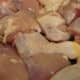 Washed and cut-up chicken legs are prepared for seasoning.