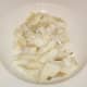 Smoked haddock is roughly flaked