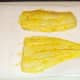 Marinated haddock fillets are patted dry with kitchen paper