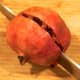2. Cut the pomegranate in half.
