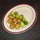 Dill-buttered potatoes and sprouts are plated