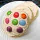 Decorate sugar cookies with brightly colored candies or sprinkles.