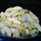 Lay the sliced apples in the slow cooker.