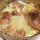 Rabbit pieces are browned and sealed in butter