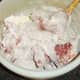 Rabbit pieces are tossed in seasoned flour