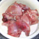 Rabbit pieces are added to seasoned flour
