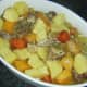 Rabbit and lamb stew is ladled in to serving dish