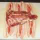 Wrapping rabbit saddle in bacon
