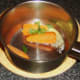 Butter and coriander is added to the drained carrots