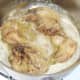 Browning rabbit pieces in butter
