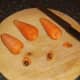 Tops are removed from carrots for cooking