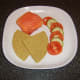 Smoked salmon and cream cheese cakes is plated with Scottish oatcakes and salad