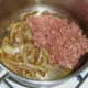 Mince is added to sauteed onion and spices