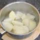 Drained potatoes are left to steam