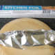 Potato is skewered and wrapped for the oven
